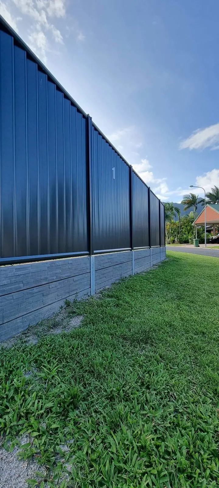Black Colorbond on stone-look concrete sleepers