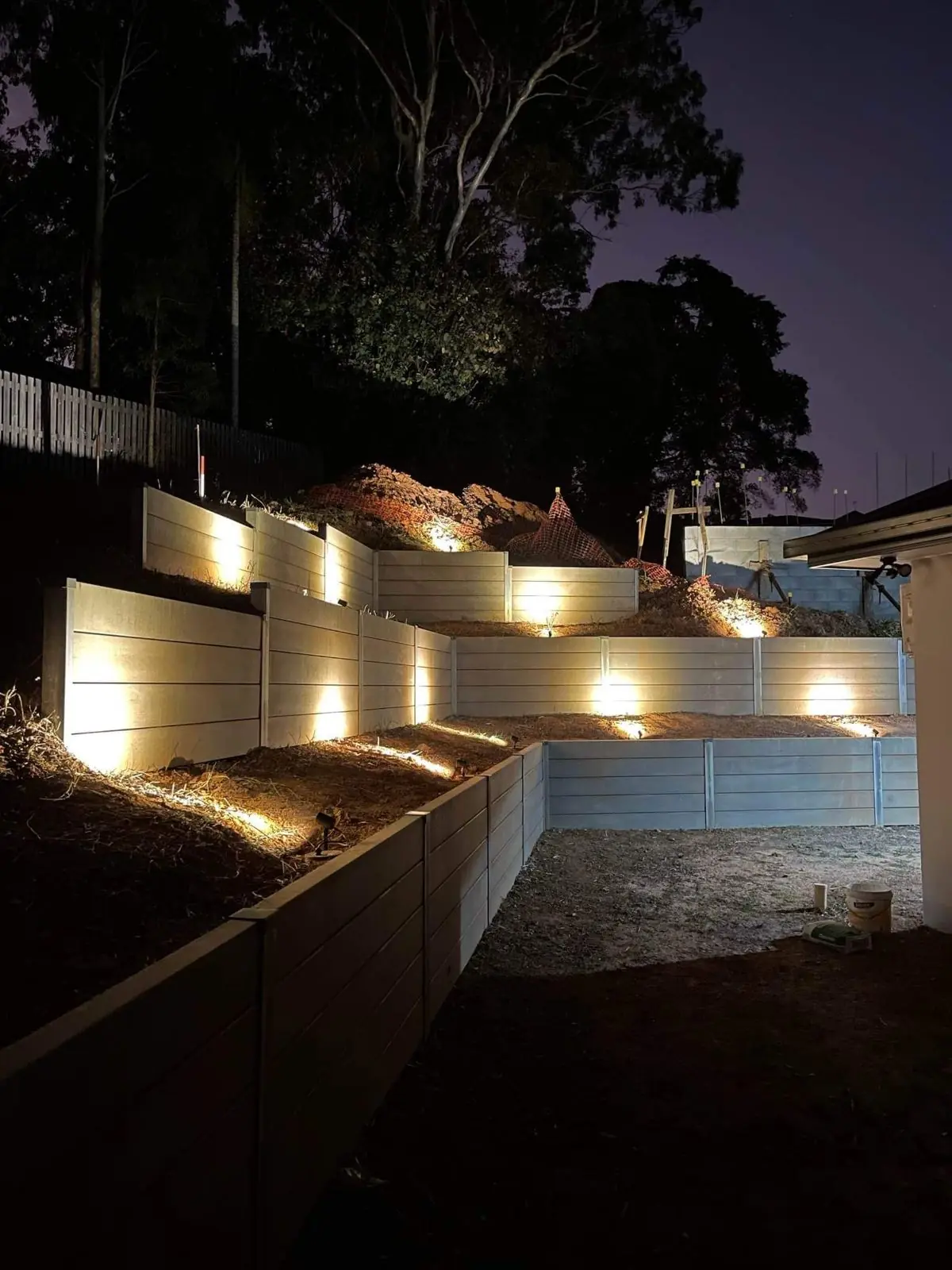 Lit tiered walls at night