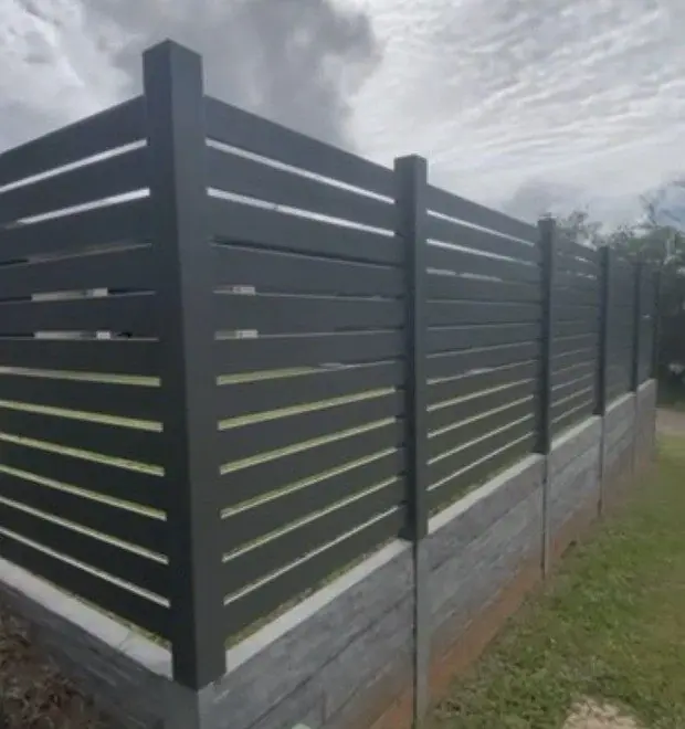 Aluminium slat fence on woodgrain concrete sleepers